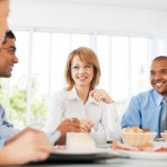 Businesspeople having lunch indoors.